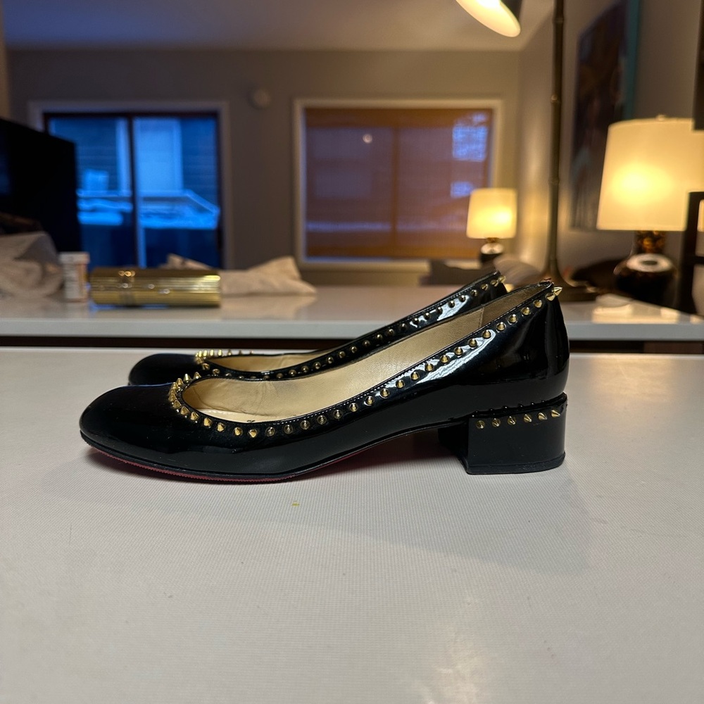 Christian Louboutin black studded patent leather shoe